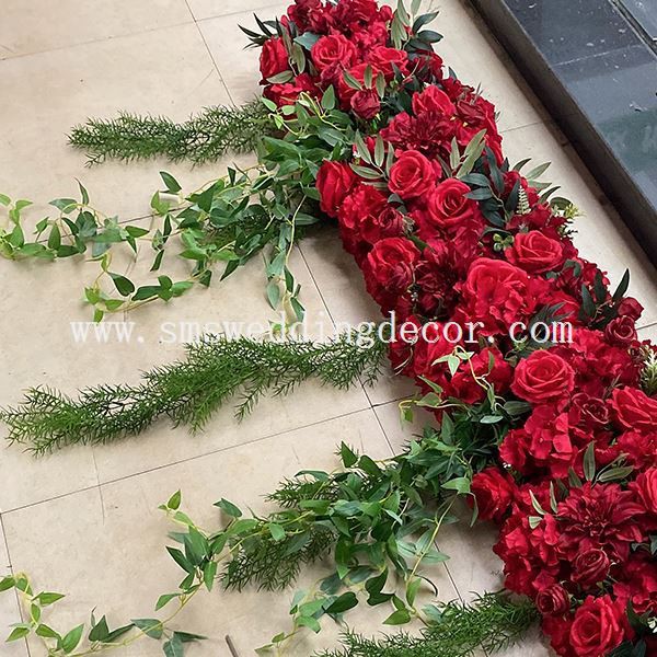wedding arch with red roses